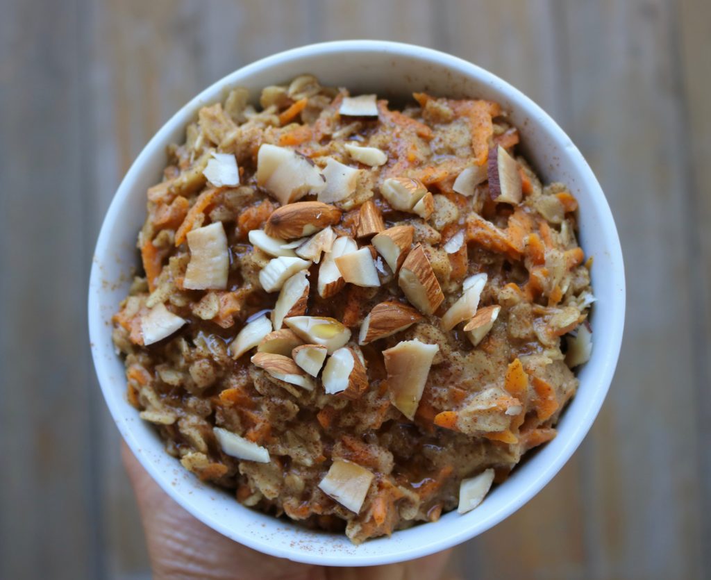 Healthy and easy carrot cake oatmeal breakfast recipe. This delicious oatmeal is vegan, gluten free, and sweetened with only maple syrup. Overnight oats and microwave options provided.