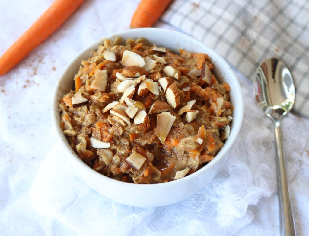 Healthy and easy carrot cake oatmeal breakfast recipe. This delicious oatmeal is vegan, gluten free, and sweetened with only maple syrup. Overnight oats and microwave options provided.