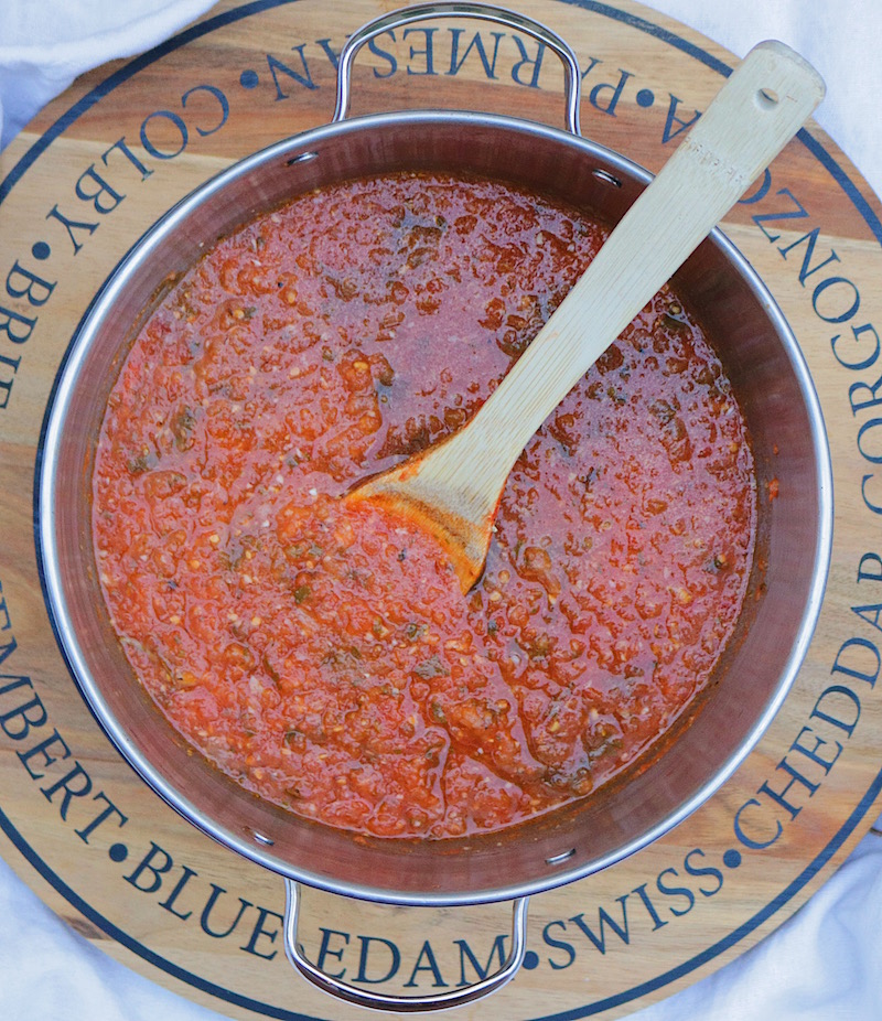 This simple homemade marinara sauce recipe uses fresh tomatoes, garlic, onion and basil. Enjoy it on pasta or use it as pizza sauce.